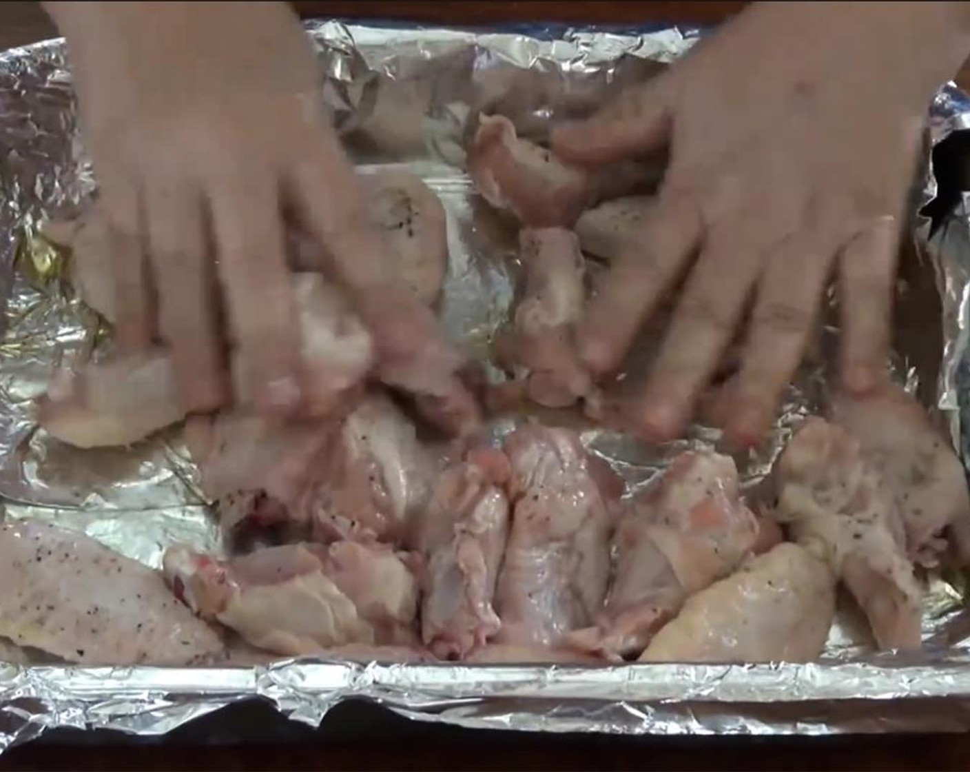 step 4 With clean hands, roll the wings around so that they are all completely coated. Place the roasting pan in the oven for 30 minutes.
