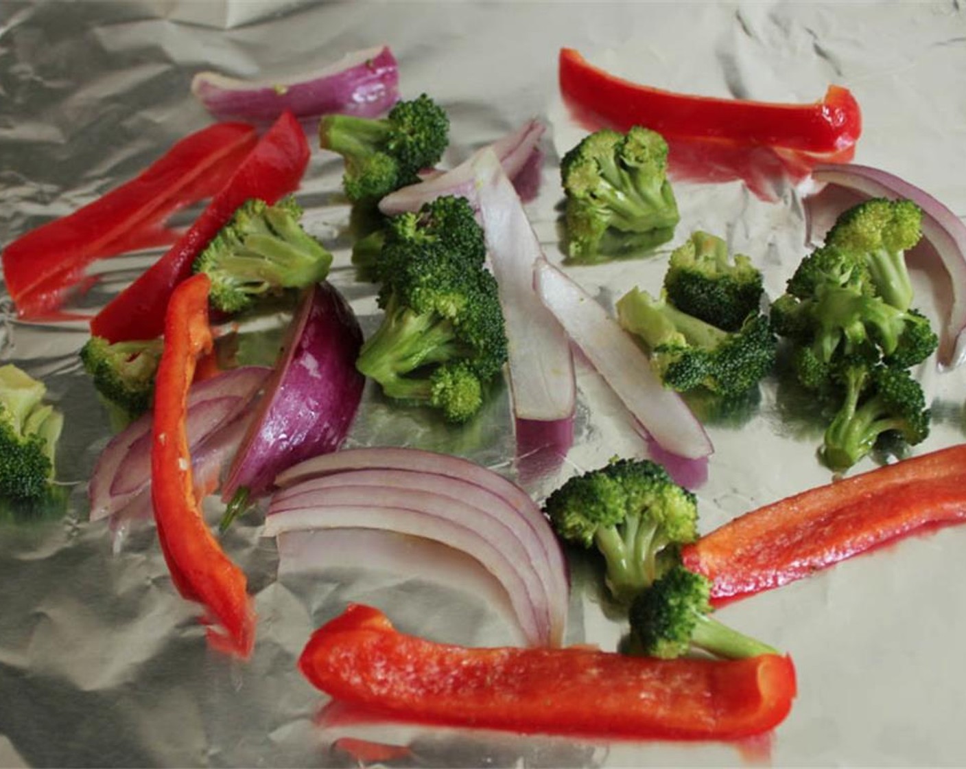 step 11 Place the Broccoli Florets (1/3 cup), Red Bell Pepper (1/2) and Red Onion (1/4) on a foil-lined baking sheet. Drizzle with Olive Oil (1/2 Tbsp) and sprinkle with Salt.