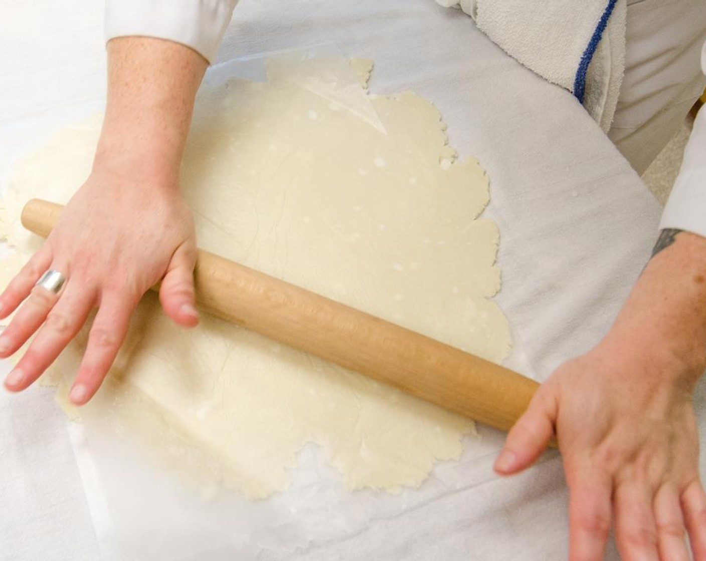 step 20 Remove the other disk of dough from the refridgerator. Between two pieces of plastic wrap, roll the dough into a 12-inch circle.