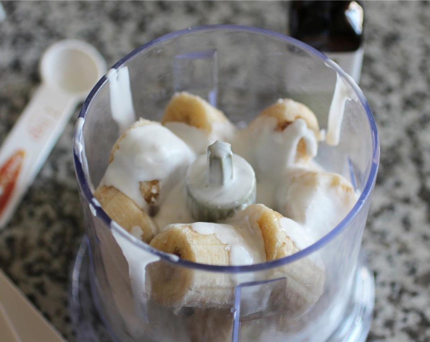 step 3 Add frozen bananas, coconut cream, and Peppermint Oil (1 tsp) to a food processor. Process until the mixture becomes like a soft-serve consistency and there doesn’t appear to be any large chunks of bananas.
