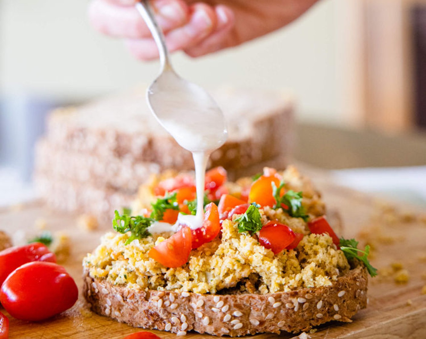 step 3 Place flattened falafel onto Whole Wheat Sprouted Bread (2 slices). Top with Pickled Onions (to taste), Grape Tomatoes (4), drizzle with tahini dressing, and some Fresh Parsley (to taste). Enjoy right away!