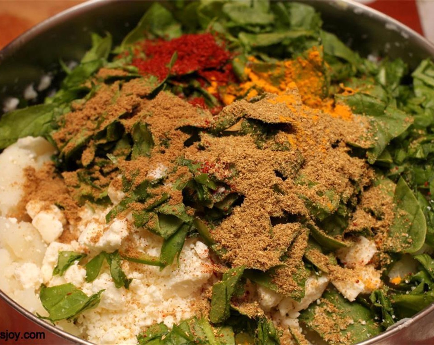 step 2 Mix with Fresh Spinach (2 cups), Chili Powder (1 tsp), Feta Cheese (1/2 cup), Ground Coriander (1/2 Tbsp), Ground Cumin (1/2 tsp), Salt (to taste), and Ground Turmeric (1 pinch). Set filling aside.