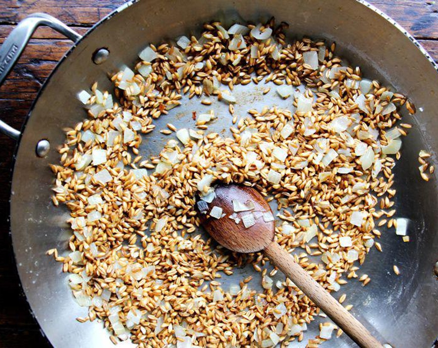 step 6 Add the Farro (1 cup) and cook stirring constantly for another minute. Add the Dry White Wine (1/2 cup) and let it reduce until it's nearly gone. Add ½ cup of the warm stock, reduce the heat to medium, and stir until the liquid is almost absorbed.