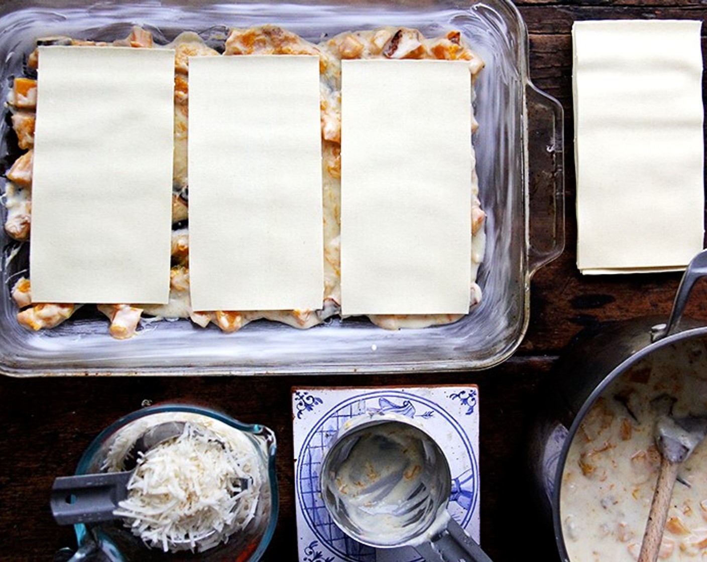 step 9 Pour 1 cup sauce into baking dish and cover with 3 sheets of No-Boil Lasagna Noodles (9 sheets), making sure they do not touch each other.