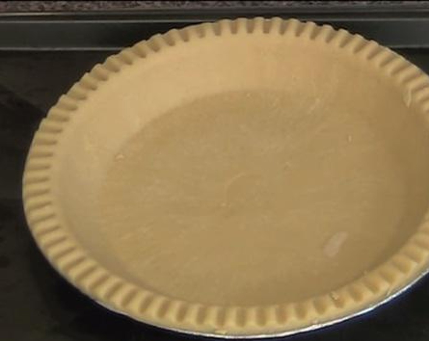 step 1 Bake the Pie Crust (1) under 220 degrees C (425 degrees F) for about 15 minutes. Meanwhile work on the filling.