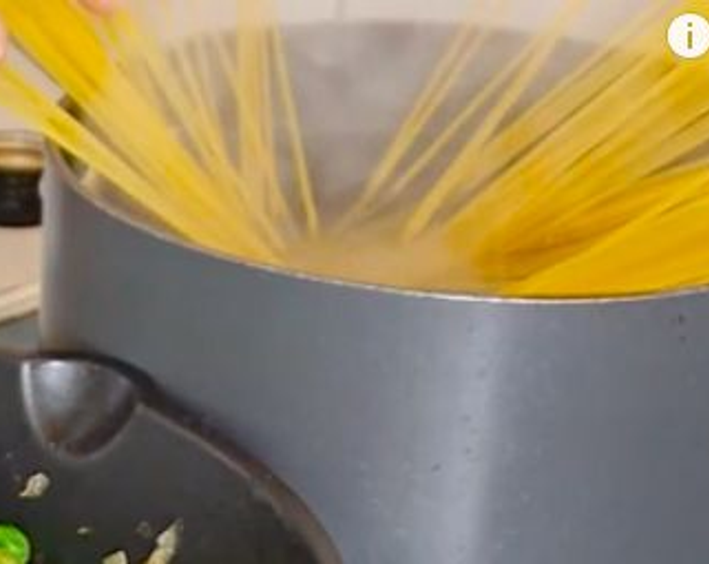 step 8 Using a handheld blender, blend the peas to a rough texture leaving some whole and add the remaining of the pasta water. Add the chopped tomato and continue to cook.