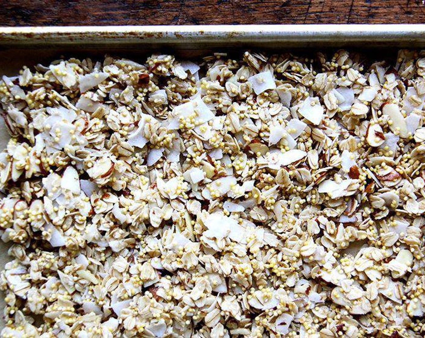 step 3 Line a baking sheet with parchment paper and spread the oat mixture out on it.