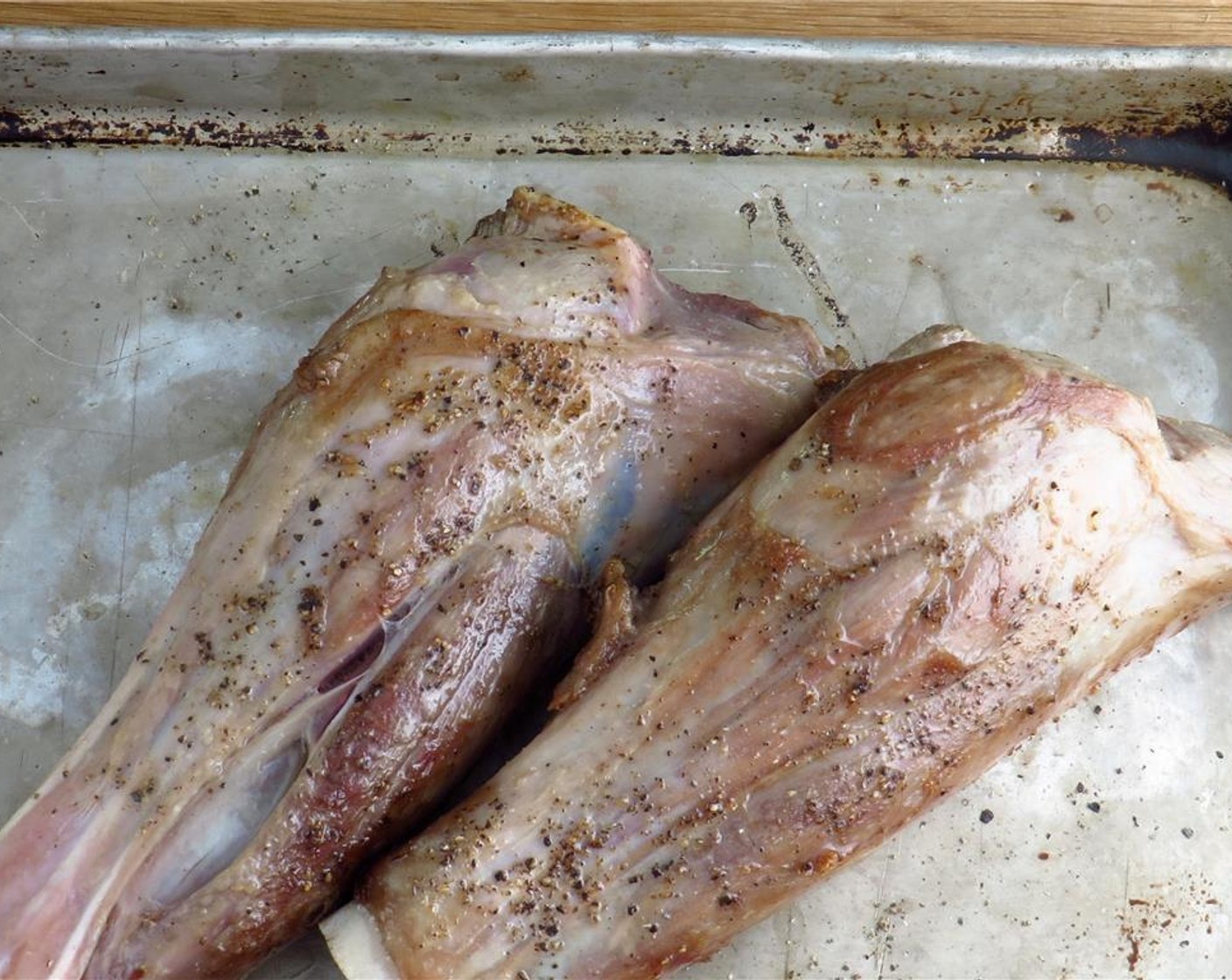 step 2 In a large dutch oven or heavy pot, heat Olive Oil (2 Tbsp) over medium high heat. Add the Lamb Shanks (4) in two batches, and sear on all sides until browned, turning with a pair of tongs, 7-9 minutes each. Transfer lamb to a tray.