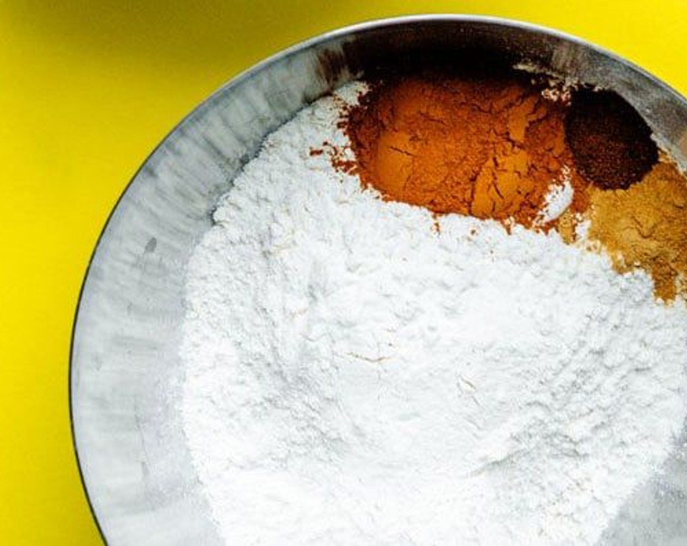 step 5 Stir together All-Purpose Flour (1 1/2 cups), Baking Powder (1 tsp), Baking Soda (1 tsp), Simply Organic Cinnamon, Ground (2 tsp), Ground Ginger (1/2 tsp), Ground Nutmeg (1/4 tsp), and Salt (1/4 tsp) in a large bowl.