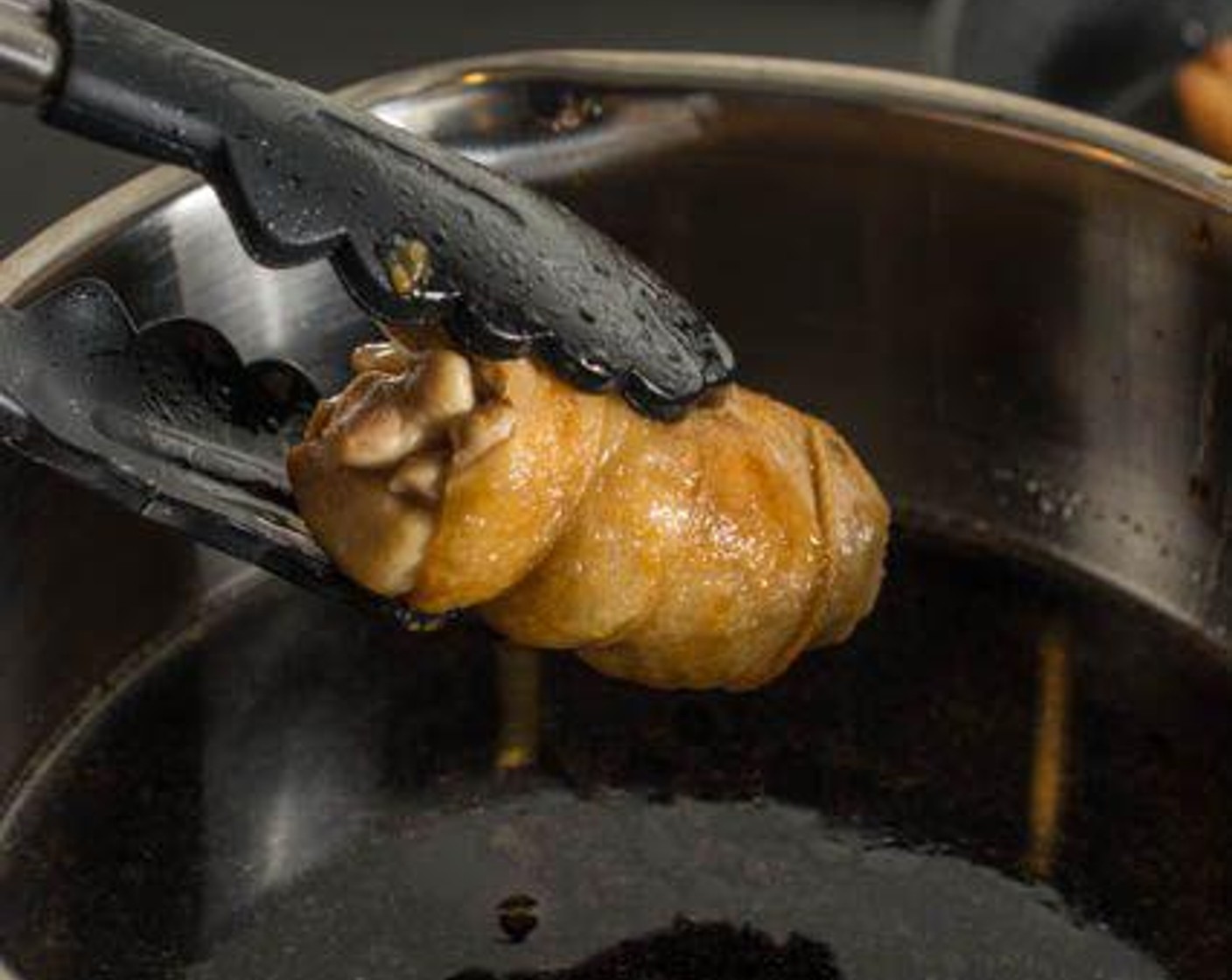 step 5 Remove from the heat and let cool to room temperature. To let the flavors soak in evenly, rotate the chicken in the seasoning liquid every 10 minutes or so while it's cooling. To make this easier, cover the top of the chicken with a heavy-duty paper towel; the paper will help the liquid evenly soak into the meat.