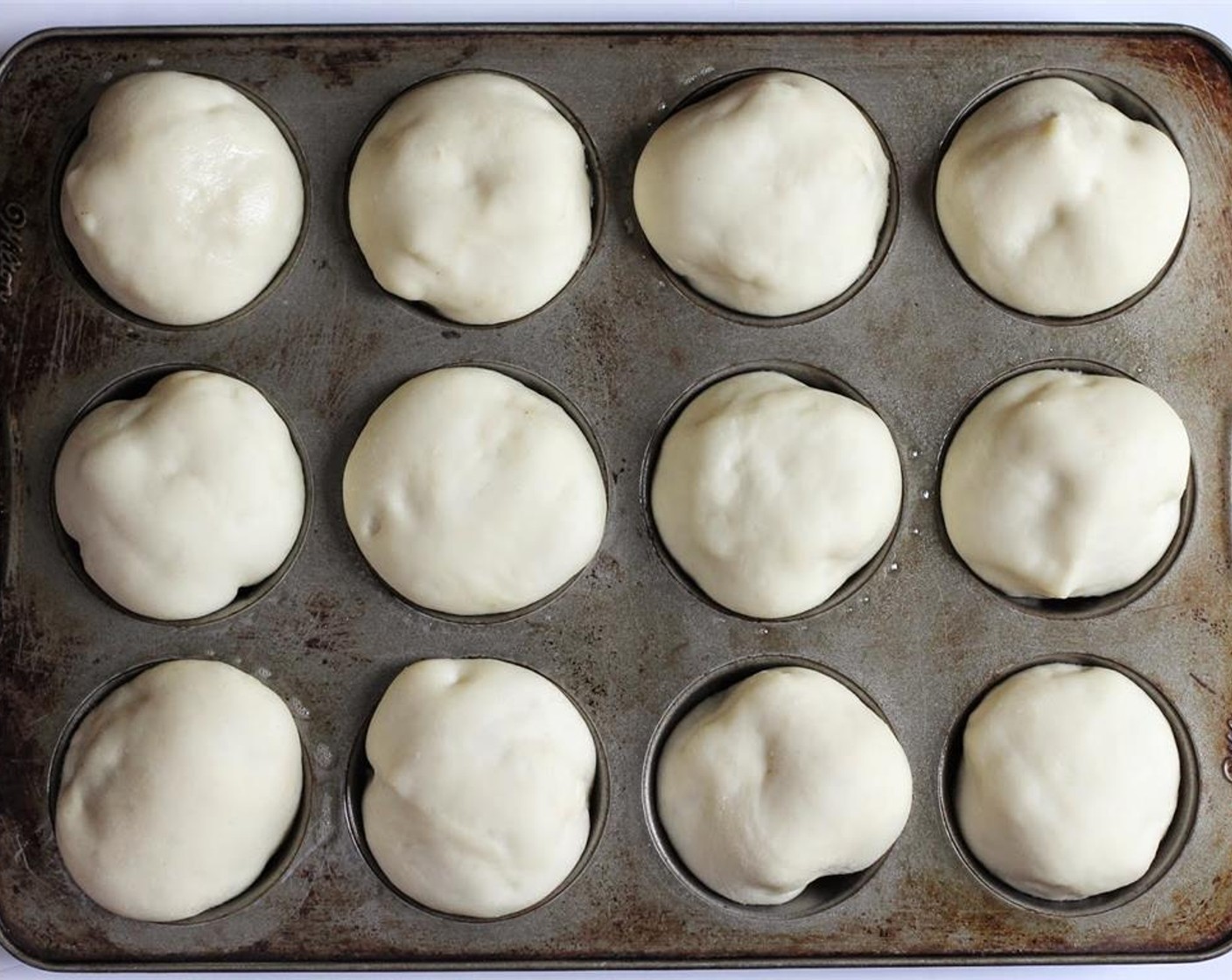 step 5 Place in greased Muffin Tin. Allow to rise 30 - 45 minutes, or until doubled in size.