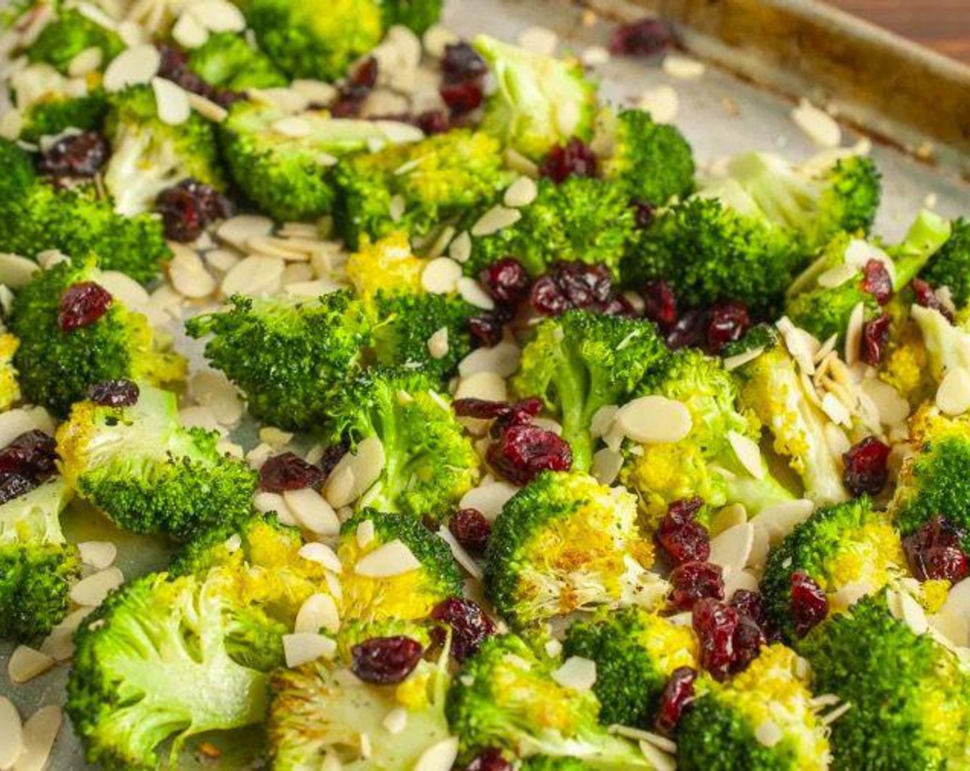 step 6 Add Dried Cranberries (1/3 cup) and toss to combine. Return to oven for 5-6 minutes, until broccoli is tender and almonds are golden.