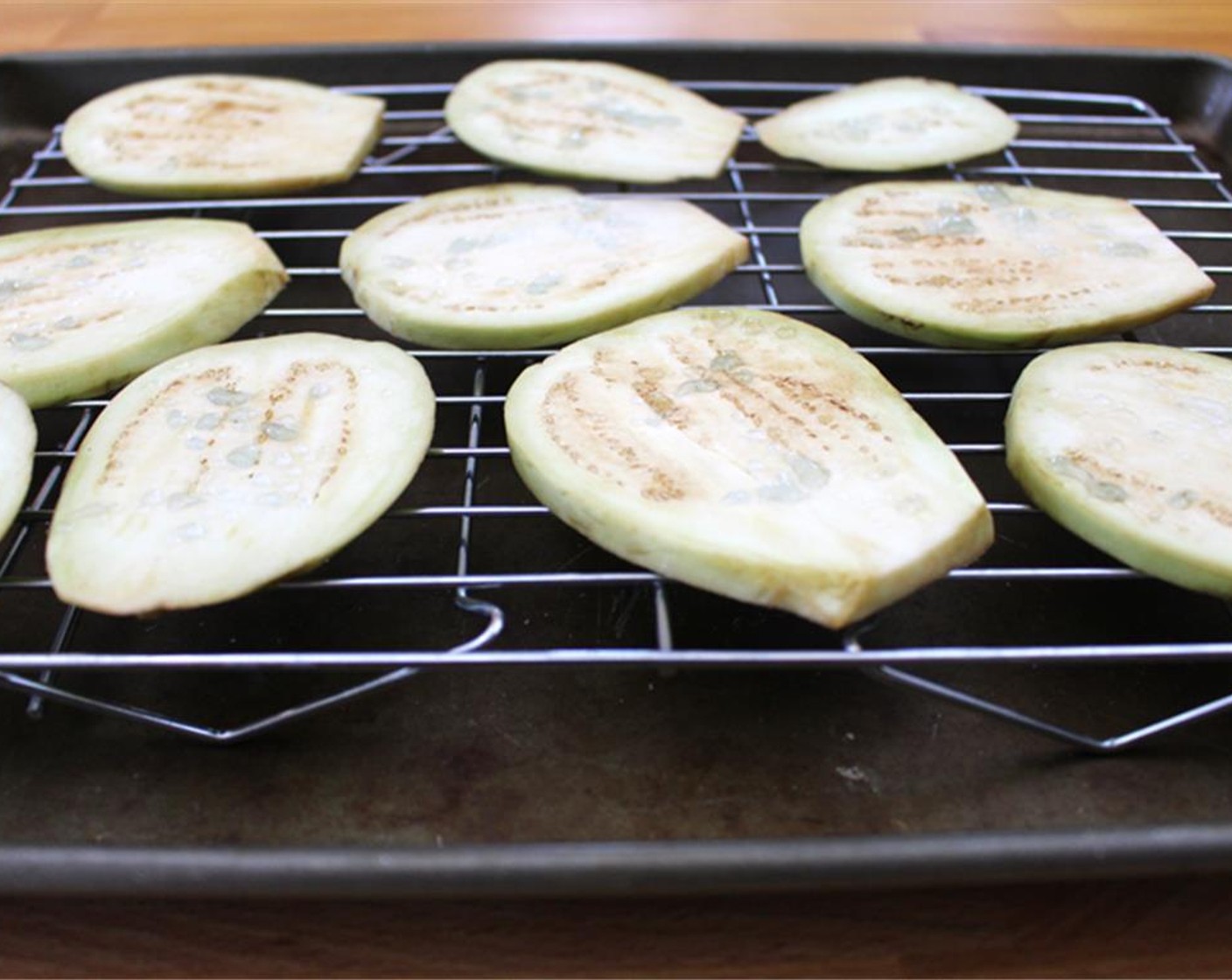 step 1 Peel and slice Eggplant (1) about a quarter-inch thick. Sprinkle eggplant with Salt (to taste) and let stand for about 15 minutes.