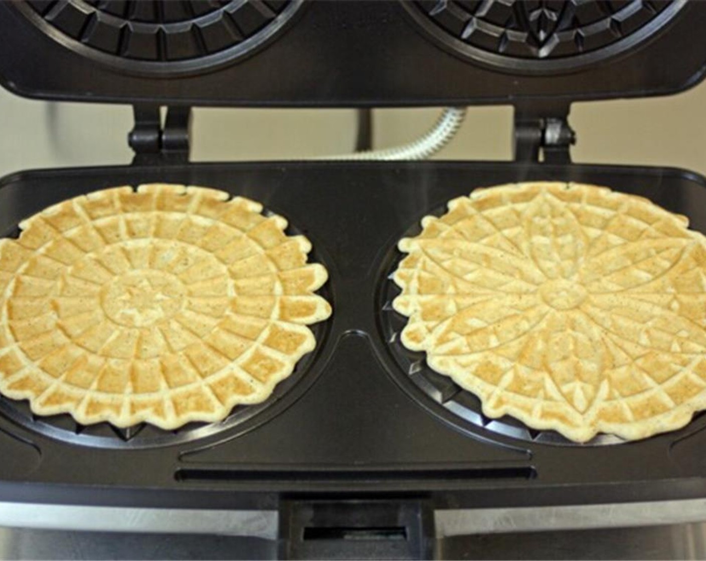 step 8 Close the pizzelle maker and check after about 20 seconds. You can close for another 10 seconds or until the cookie is golden brown.