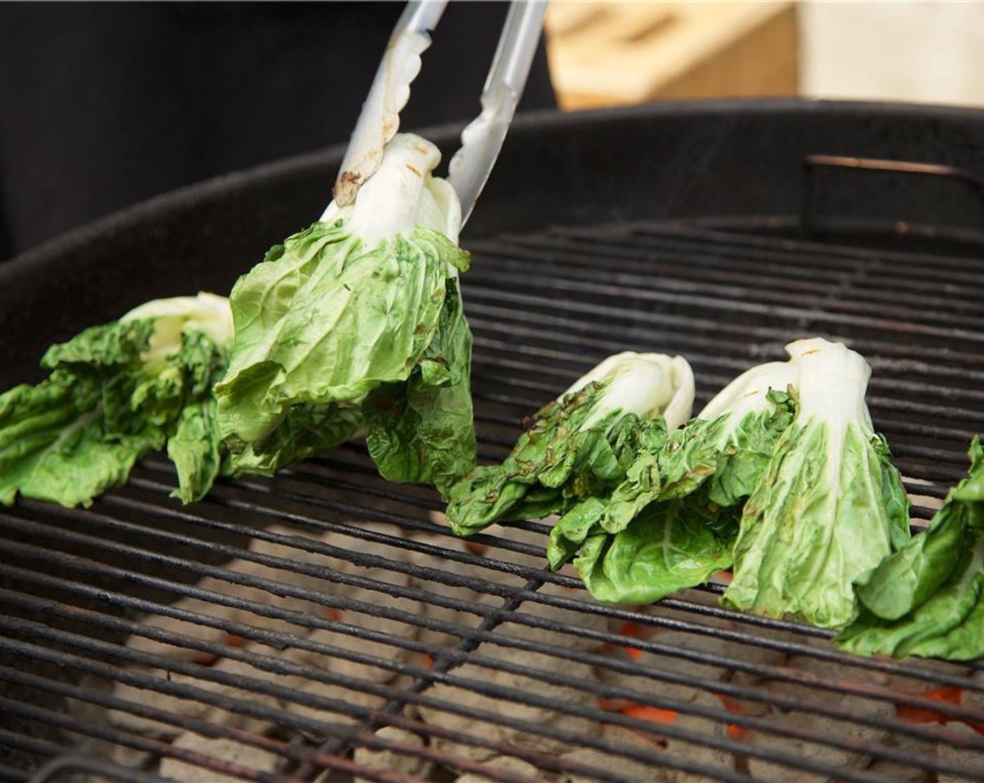 step 14 Place Choy Sum (12 oz) on the grill, keeping the dark leafy greens away from the hottest section of the grill. Cook the choi sum on each side for two minutes. Move to the cooler section of your grill to keep warm.