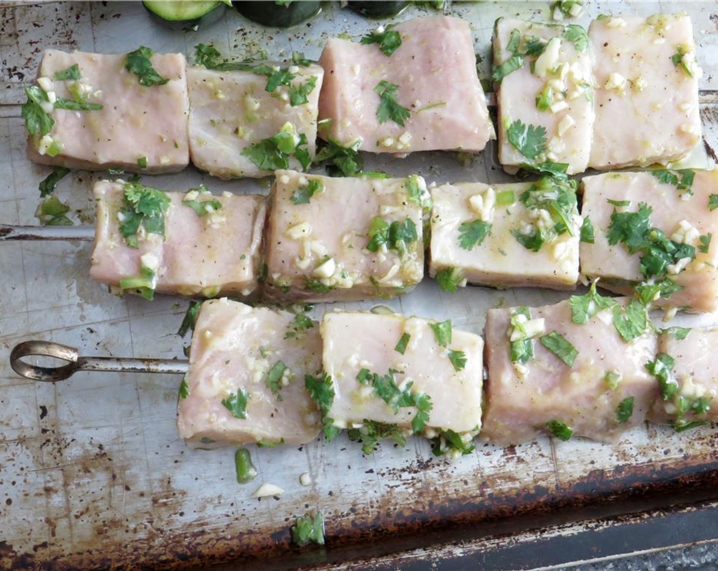 step 6 Thread swordfish onto skewers. Grill the fish 3 to 4 minutes on one side, or until they begin to get grill marks, then turn, and cook 3 to 4 more minutes.