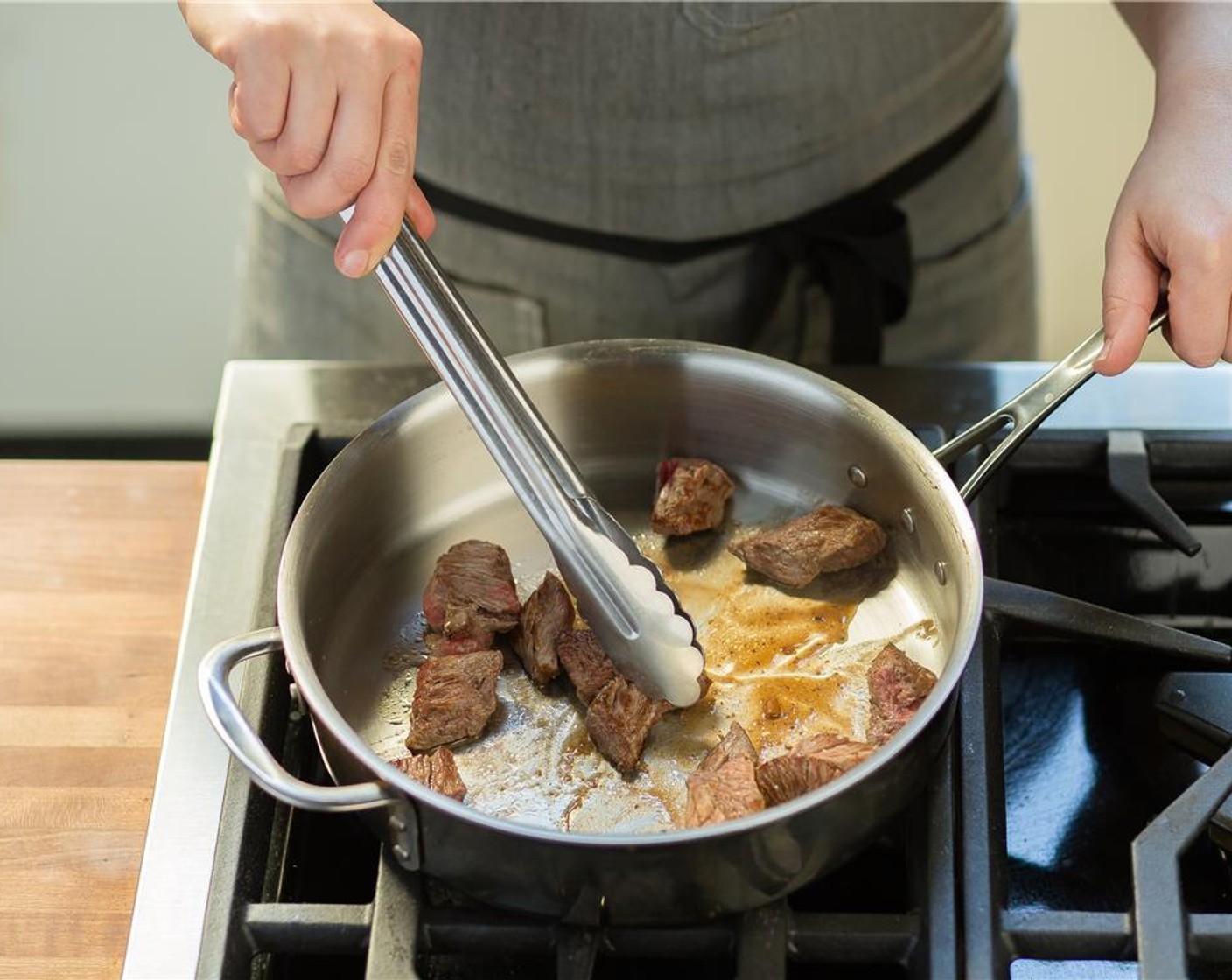 step 7 Add beef and sauté for 5 minutes, turning to brown on all sides. Transfer to a plate.