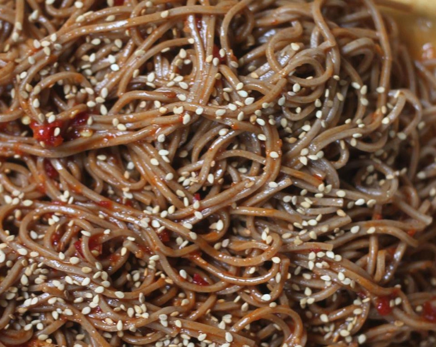 step 7 When dry, toss in the baking dish with the remaining sauce and Toasted White Sesame Seeds (1 Tbsp).