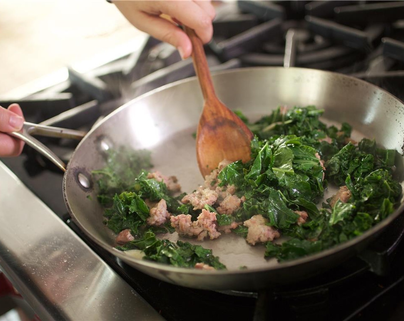 step 5 Add the garlic cloves and chopped Kale (3 1/3 cups) and cook for two minutes.