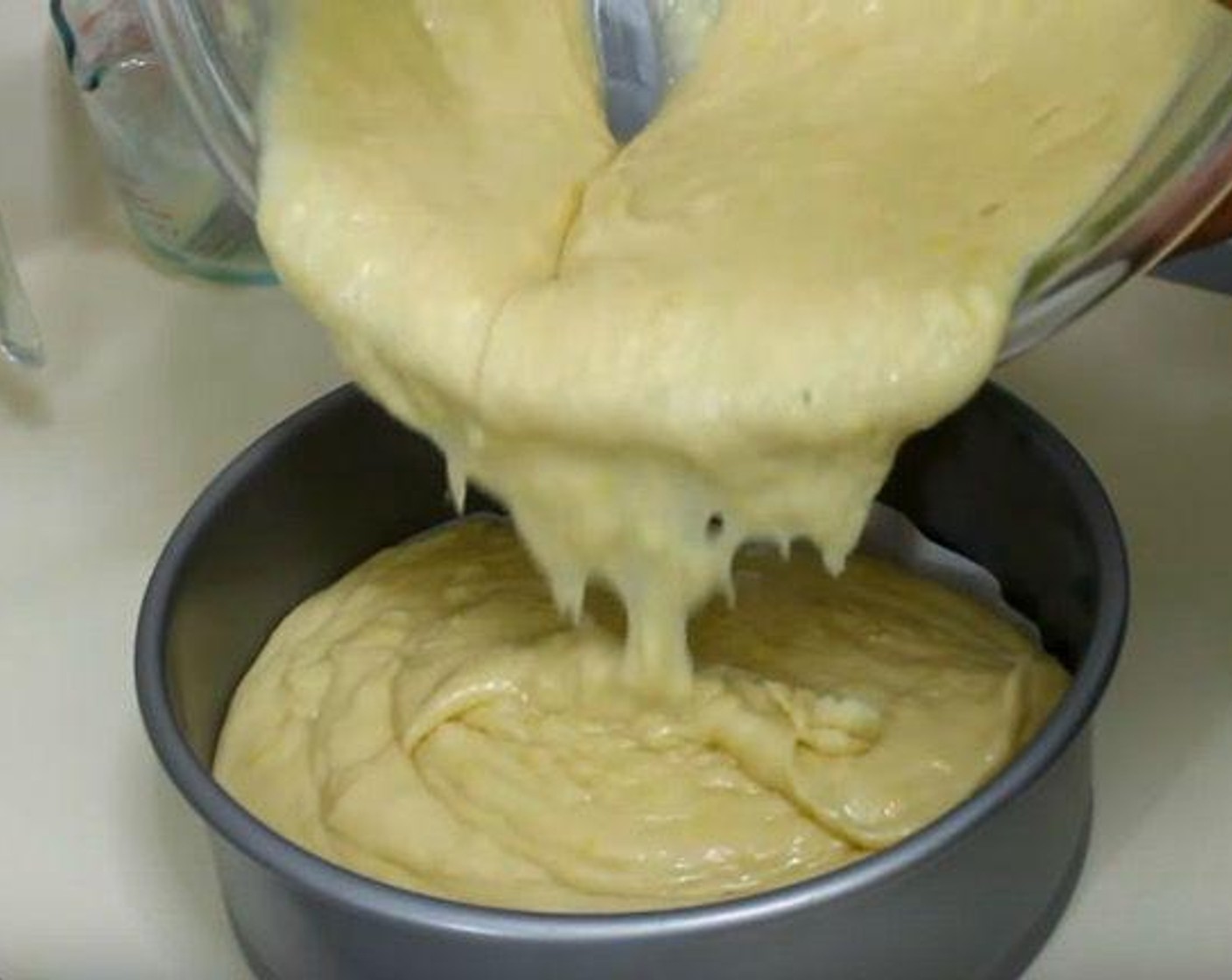 step 4 Transfer batter to a 9-inch springform pan lined with parchment paper.