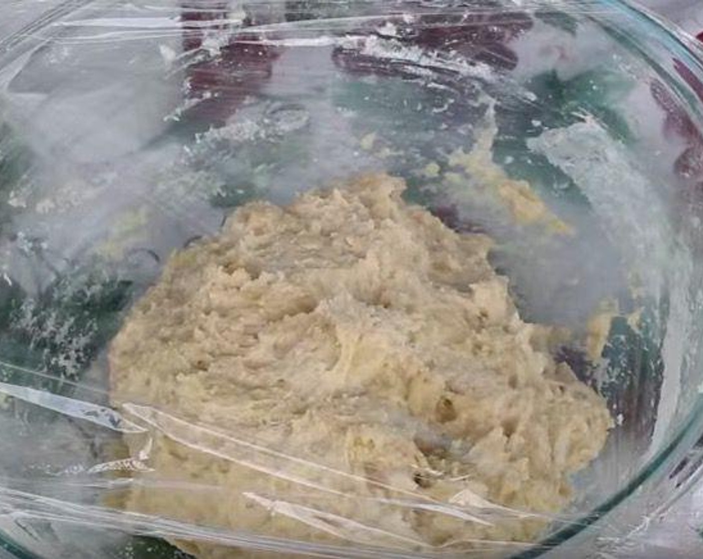 step 3 Form the dough into a ball. Cover the bowl with plastic wrap and place a dish towel over top. Let it rise for 1 hour.