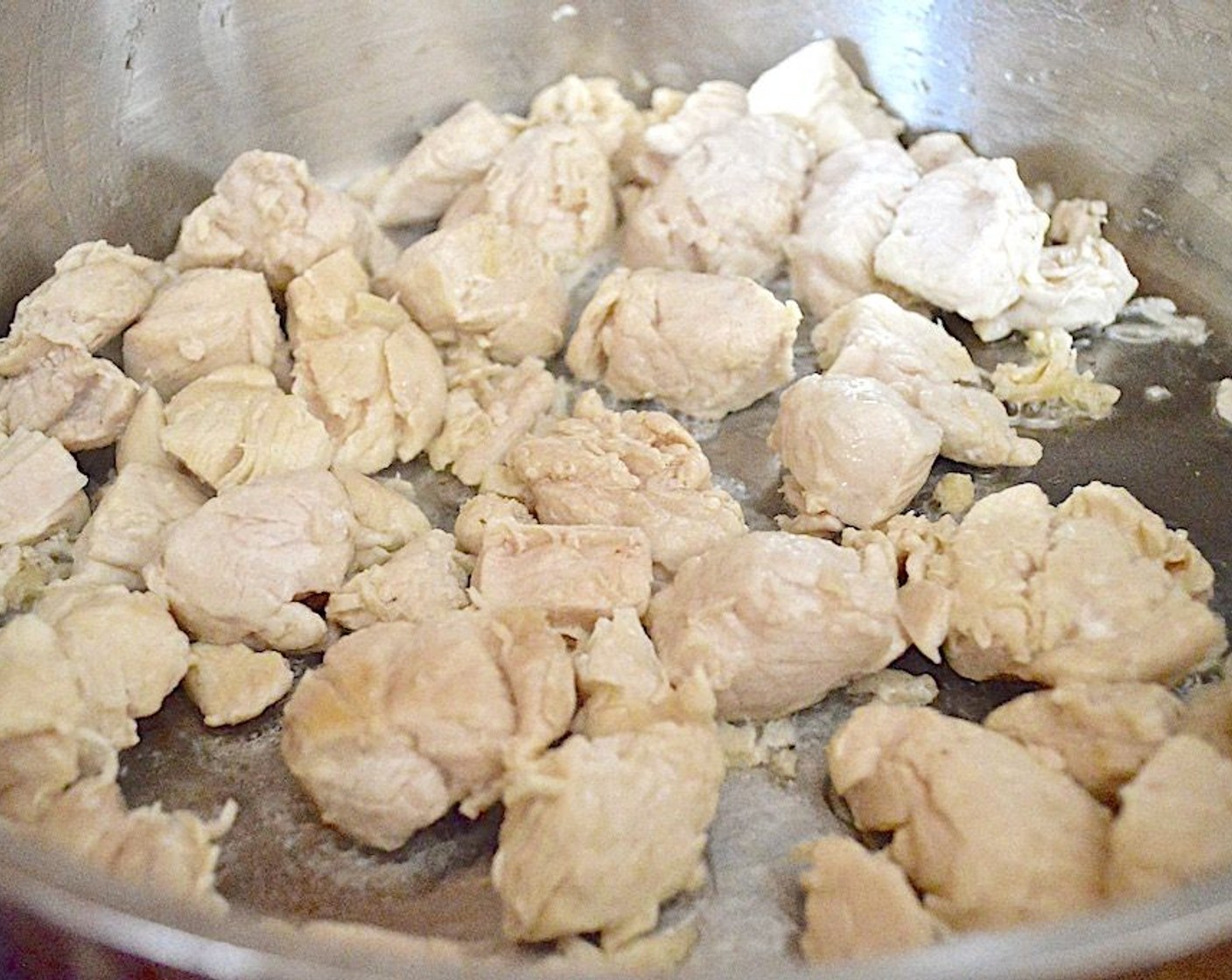 step 2 Get out a large skillet with deep sides. Heat 1 tablespoon of Olive Oil (1 Tbsp) in the skillet over medium-high heat and season Boneless Skinless Chicken (1 lb) with Salt (1 pinch). Brown the chicken until it starts to to develop some color and is cooked through.