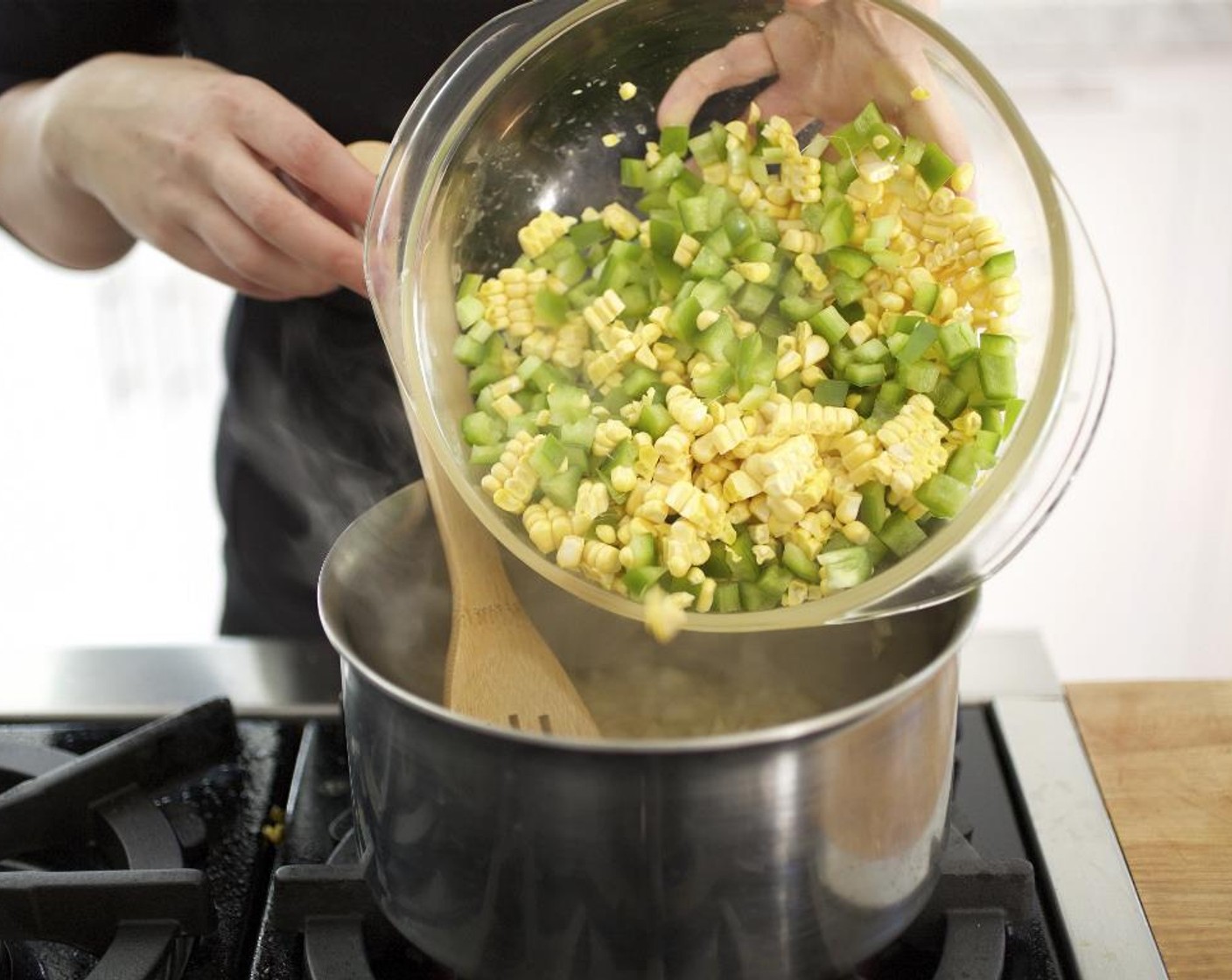 step 8 Add the bell pepper, celery and corn to the onions and cook until the vegetables soften, about 5 more minutes, stirring occasionally.