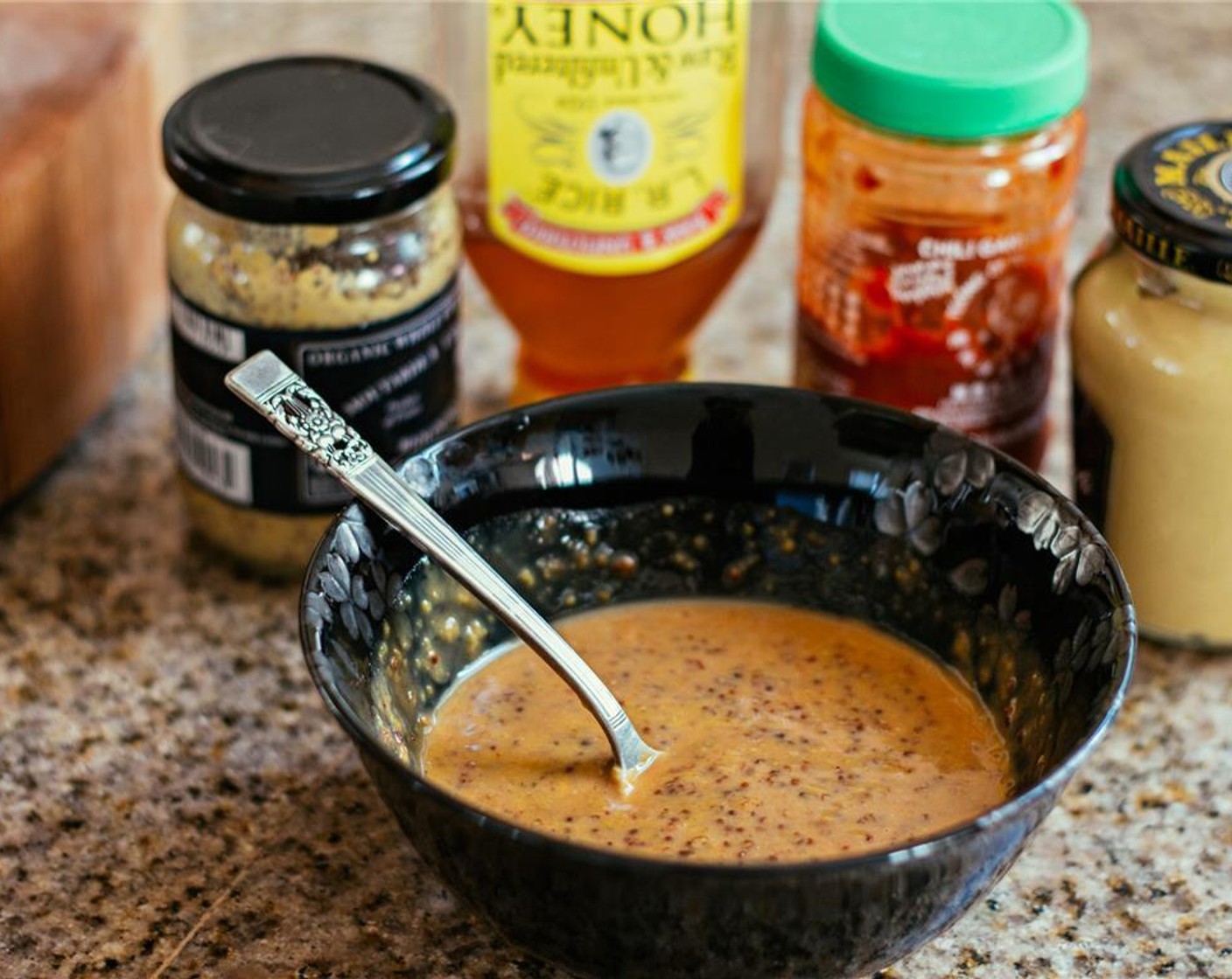 step 5 In a small bowl, whisk together the Whole Grain Mustard (2 Tbsp), Dijon Mustard (2 Tbsp), Honey (1/4 cup), and Chili Garlic Sauce (1 tsp).