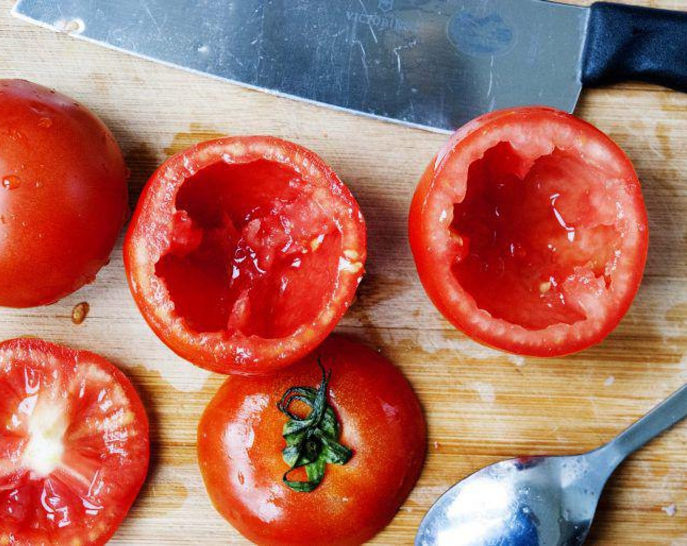 step 1 Wash the Tomatoes (3), cut off the top, about 1 inch, using a spoon, scoop out the internal seeds, season with salt and place upside down on some kitchen towel. Let it seat for 30 min so that the tomatoes can release some of their water.