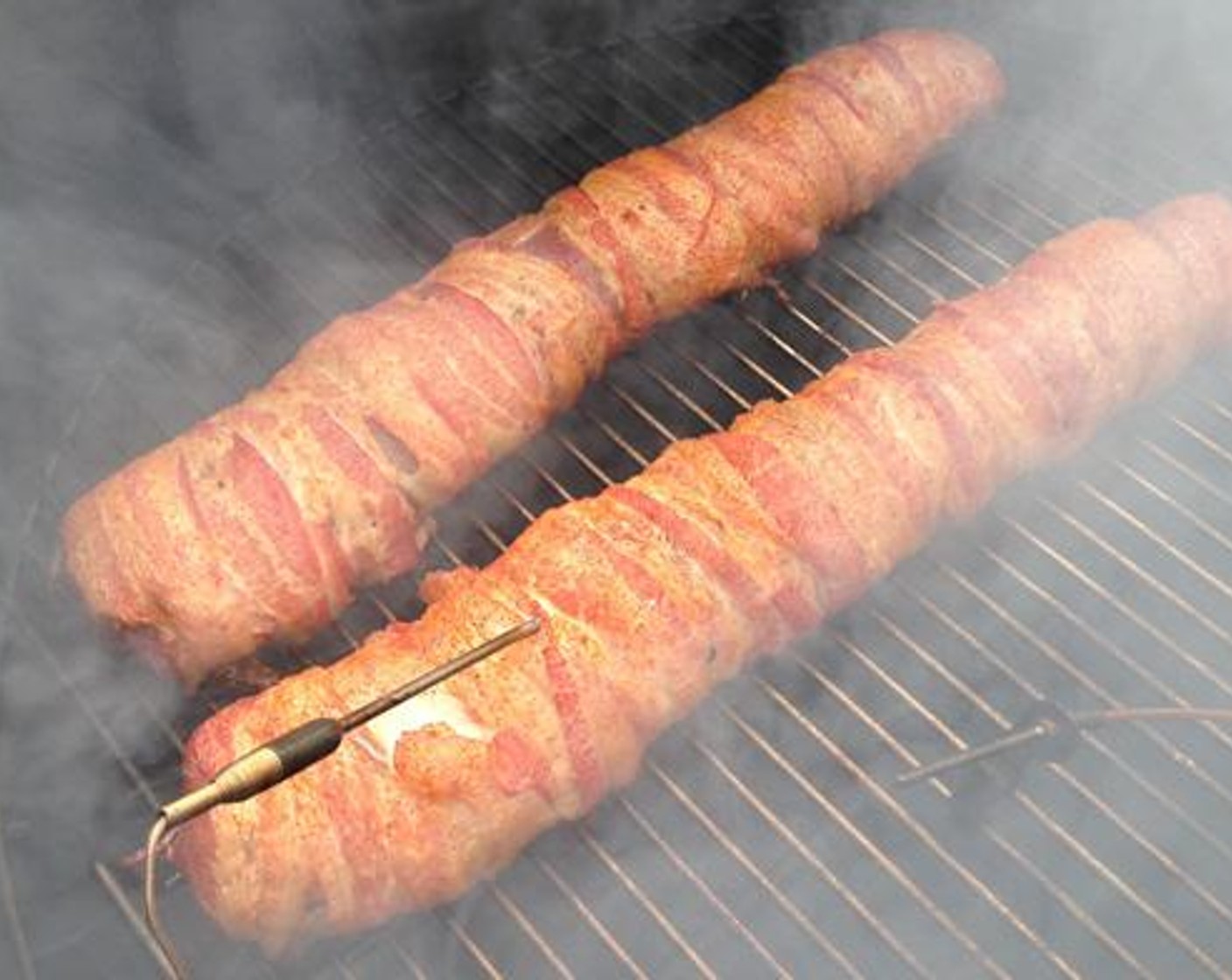 step 5 Once the cooker is up to temperature add a chunk or two of pecan wood and place the backstraps on the cooking grate. It’s going to take about 1 -1 ½ hours of cooking but I highly recommend using an internal thermometer so you can keep an eye on the temperature as it climbs.