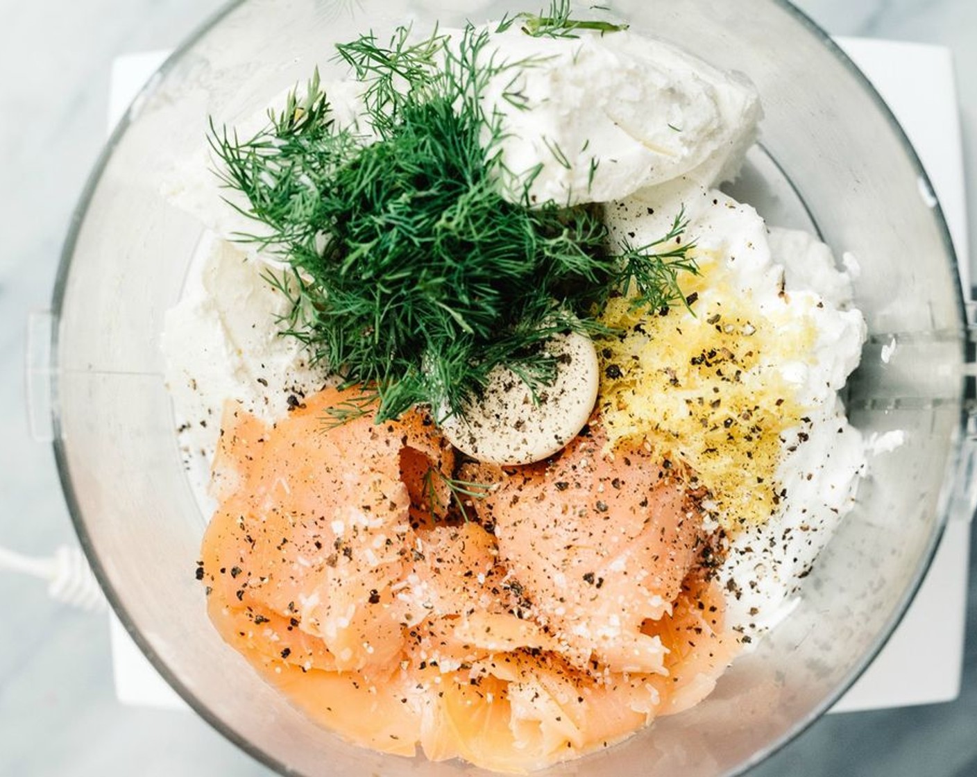 step 2 Start by adding a small amount of Salt (1 pinch). Smoked salmon is salty and Ritz crackers have a level of saltiness too. You can always add more after tasting and before serving. Blend the ingredients until smooth. You may need to stop and scrape the sides and then blend some more.