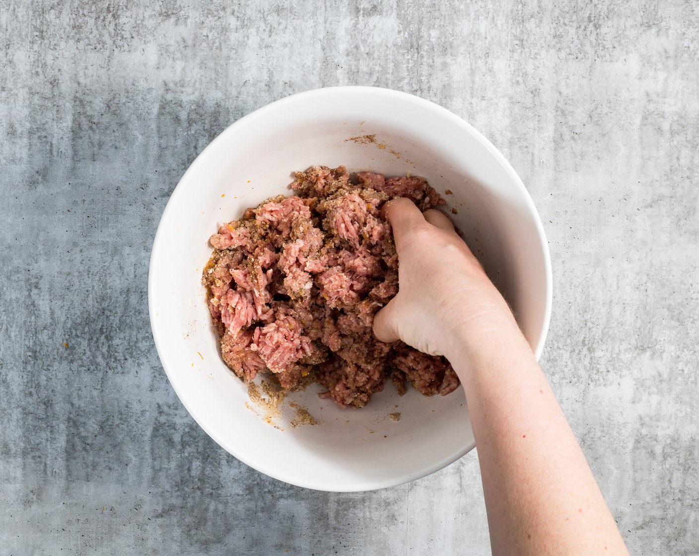step 2 Make the meatballs. In a large bowl, mix Ground Pork (1 lb), Breadcrumbs (1/2 cup), Eggland's Best Classic Egg (1), Milk (2 Tbsp), Simply Organic Garlic Powder (1 tsp), Mediterranean Spices (1 Tbsp), and Lemon (1). Combine well with your hands, then form the mixture into 20 meatballs; each meatball will be about a Tbsp of the mixture.