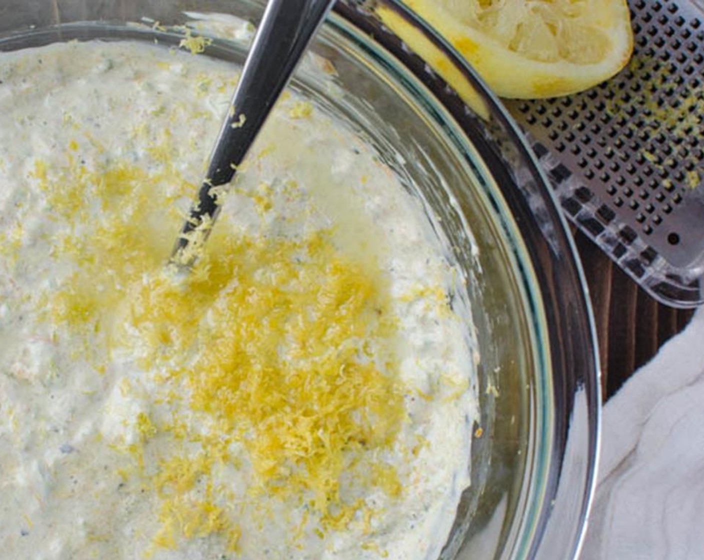 step 6 Add the Mayonnaise (1 1/2 cups). Using a microplane grater, zest the Lemon (1) and add it to the bowl. Cut the lemon in half and squeeze the juice from half the lemon into the mixture. Season with Kosher Salt (1/4 tsp). Refrigerate until ready to use.
