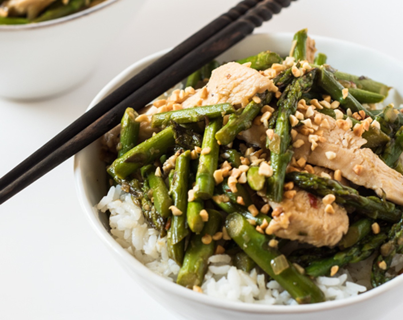 step 7 Spoon the lemongrass chicken and asparagus over the rice and sprinkle some Cashew Nuts (1/4 cup) if desired.
