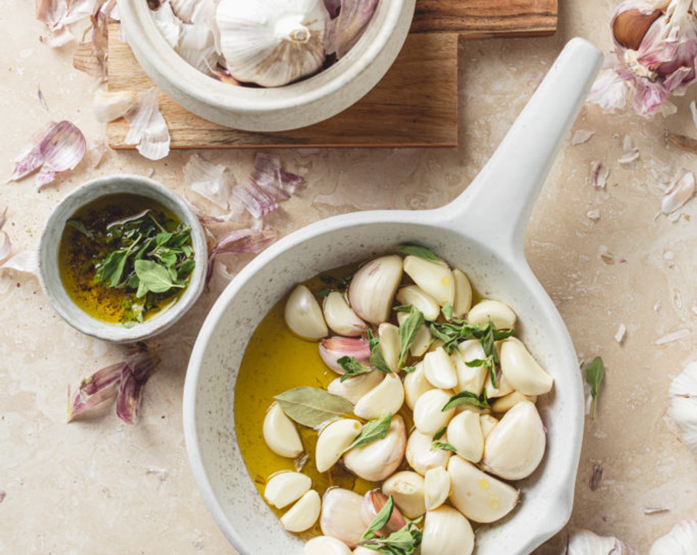 step 1 Add the Garlic (4 cups), Olive Oil (1 3/4 cups), Bay Leaves (2), and Fresh Oregano (4 sprigs) to a pot.