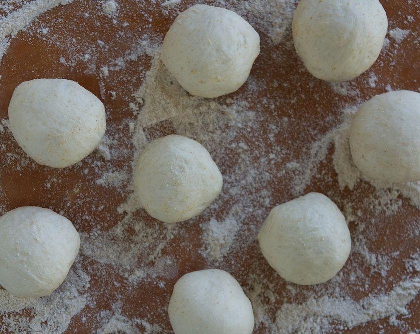 step 2 Prepare your Pizza Dough (10 oz). Divide the dough into 4 balls, quarter each of the 4 balls, then cut in half again (each ball gives you 8 pieces). Roll each piece into a circle. Pinch the edges to form triangles. Place on a baking sheet.