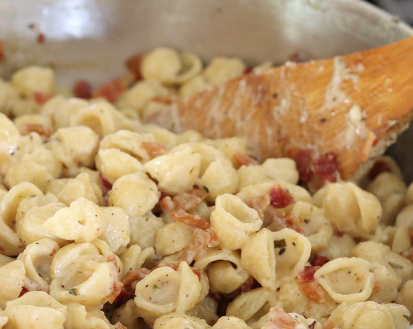 step 8 Slowly add 2 tablespoons of reserved pasta cooking water. Stir to incorporate and smooth out the sauce. If the sauce tastes gritty, continue to add pasta water 1 tablespoon at a time until smooth.