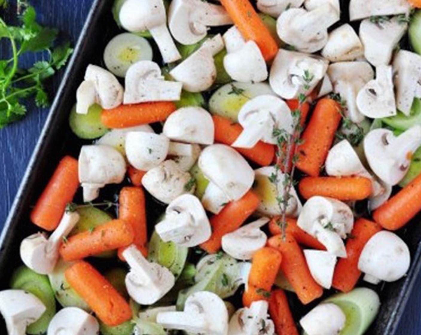step 4 Arrange the Baby Carrots (3 1/2 cups), Leeks (3), and Button Mushrooms (4 1/2 cups) in a roasting pan.