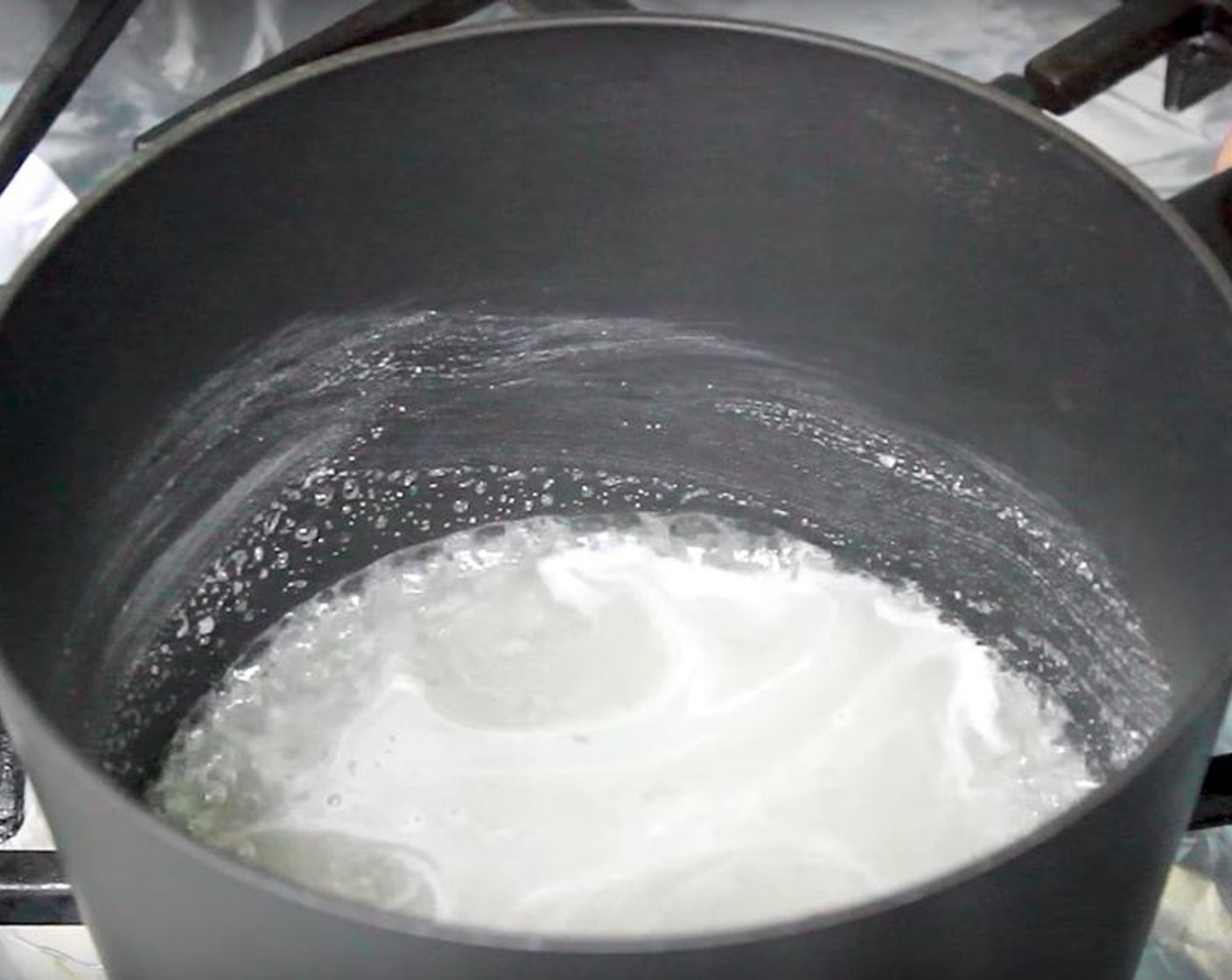 step 1 In a heavy bottom sauce pan over high heat, add Granulated Sugar (1 cup) and Water (1/3 cup). Swirl the pan until the Granulated Sugar and Water are mixed together. Allow the sugar to dissolve.