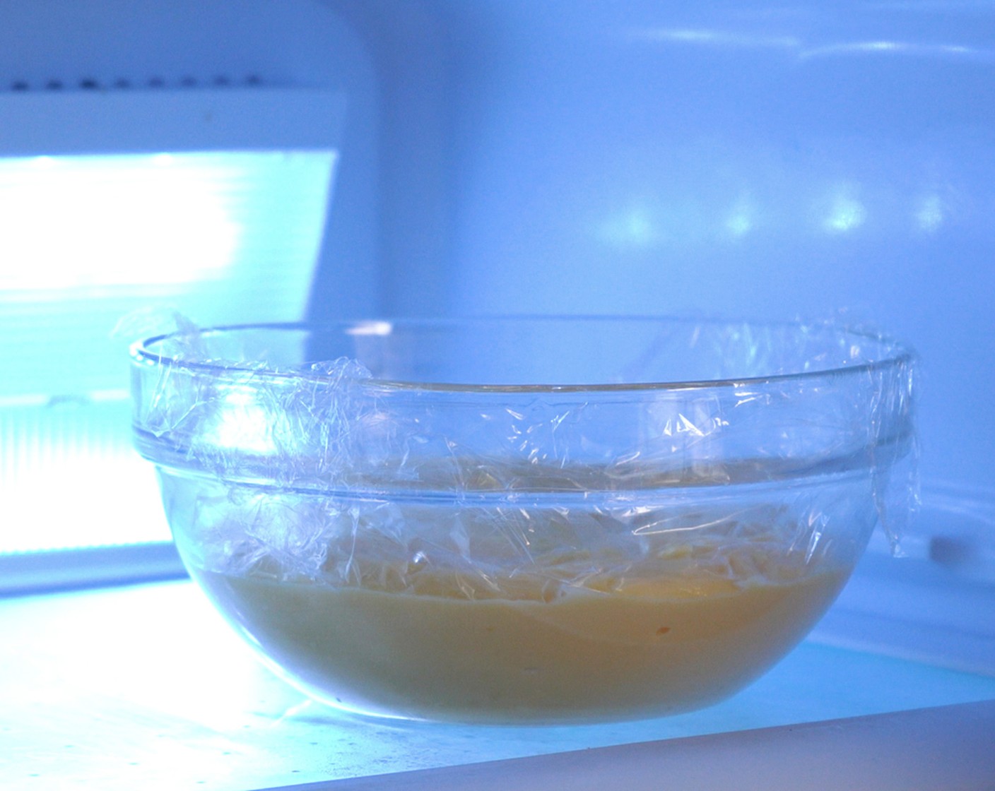 step 7 Pour the pastry cream into a bowl. Press plastic wrap over the top of the pastry cream to prevent skin from forming. Refrigerate to cool slightly.