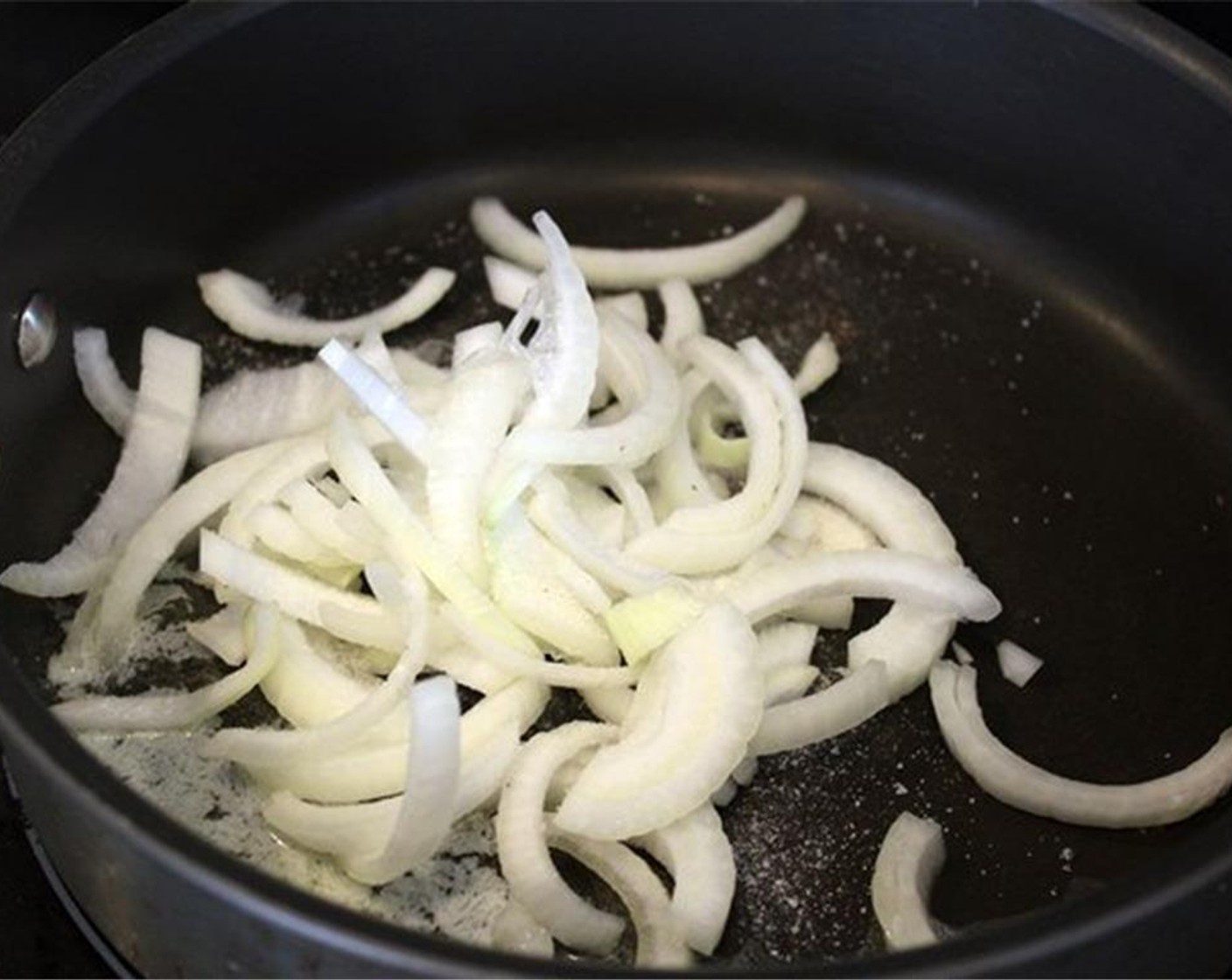 step 15 Heat a skillet on medium heat. Add Butter (1 Tbsp) to the pan. When it's melted, add the onions with a pinch of salt. Let cook for 1 minute.