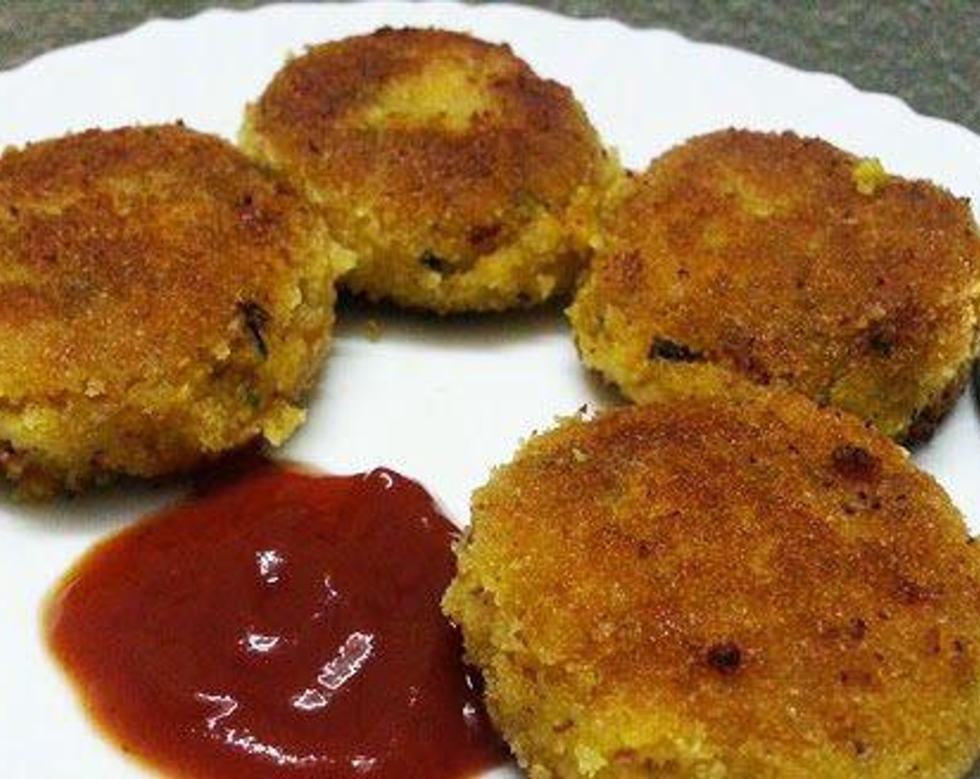 step 4 Once the mixture gets cooled use your hands and knead the paneer mixture well. Take lemon sized balls out of the mixture and roll it to the required shape. Dip in corn flour paste or egg and roll in Breadcrumbs (2 cups). Shallow fry in oil. Serve hot.