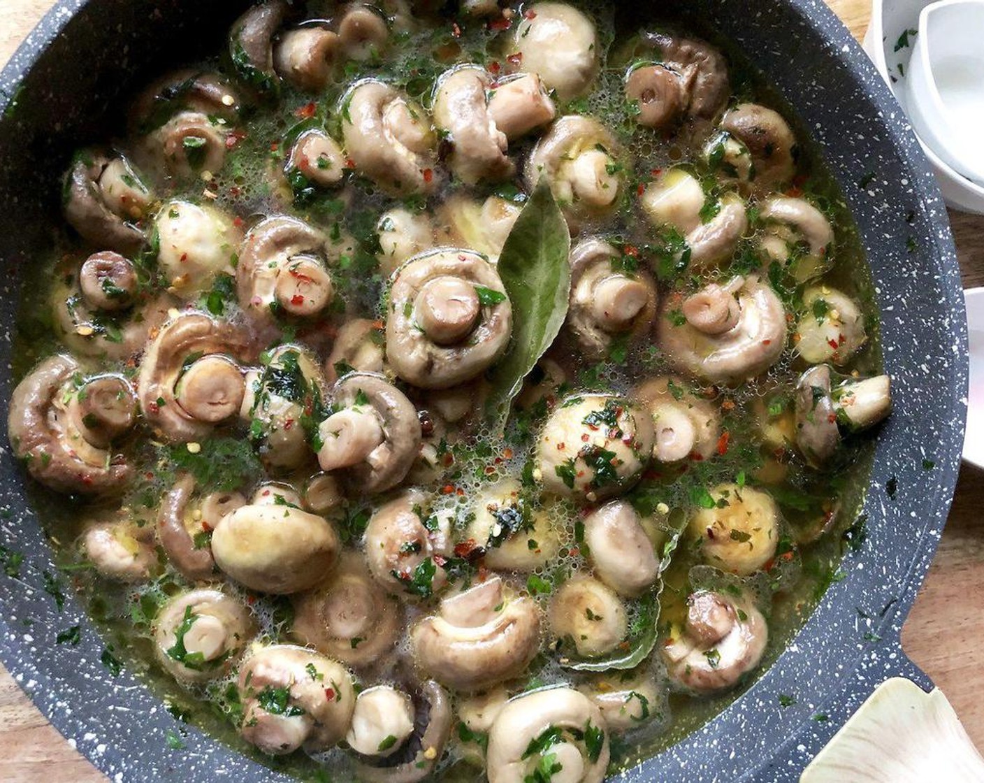 step 3 Reduce heat to medium-low and stir in the Dry White Wine (1 1/2 cups), juice from Lemons (1 1/4), Red Wine Vinegar (3 Tbsp), Whole Cloves (6), Bay Leaves (2), Crushed Red Pepper Flakes (1/2 tsp), Kosher Salt (1/2 tsp), and Freshly Ground Black Pepper (1/4 tsp). Cover and simmer for 5 minutes.