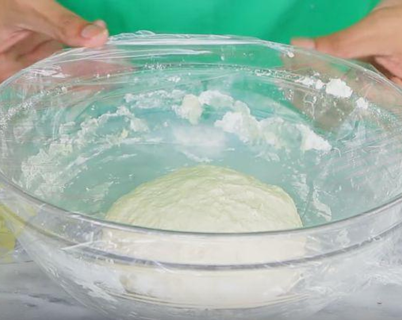 step 4 Cover the dough with plastic and a kitchen towel and place somewhere warm for 2-4 hours to double in size.