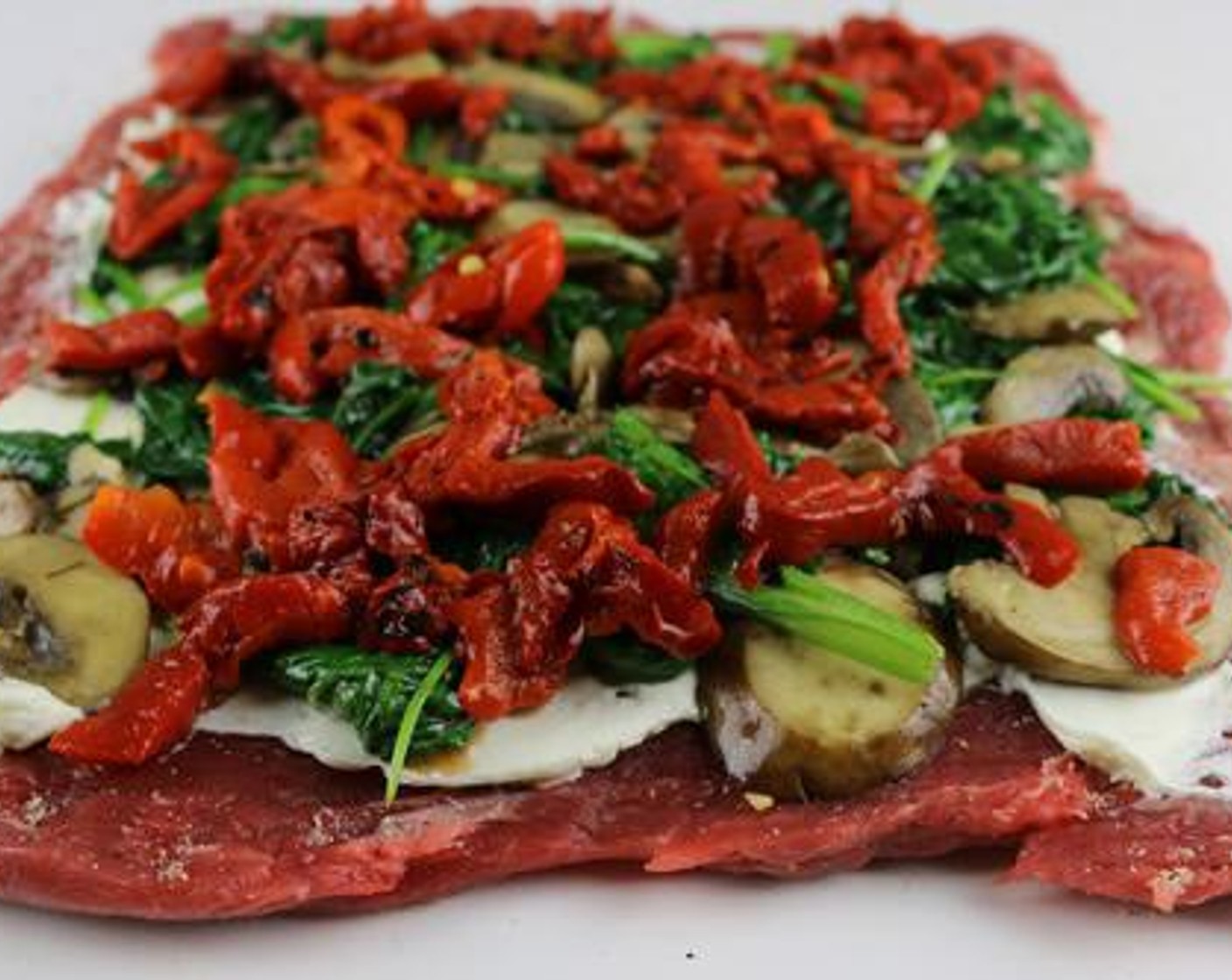 step 5 Layer the spinach-mushroom mixture on the cream cheese and top with Roasted Red Bell Pepper (1/4 cup).