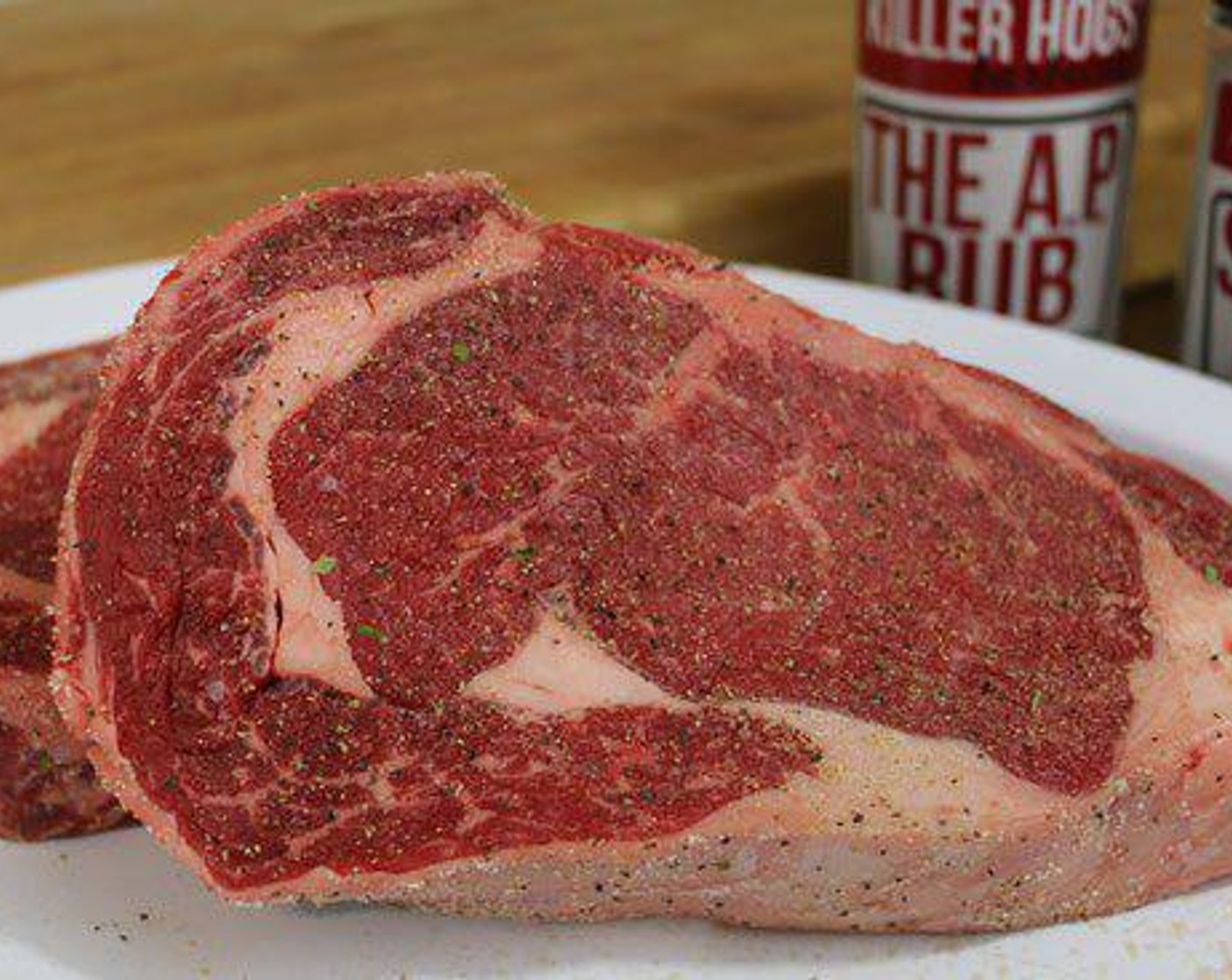 step 1 About an hour before you plan to grill the Rib Eye Steak (2) take them out of the refrigerator.  Each steak gets seasoned on all sides with Salt (to taste), Ground Black Pepper (to taste) and Granulated Garlic (to taste).