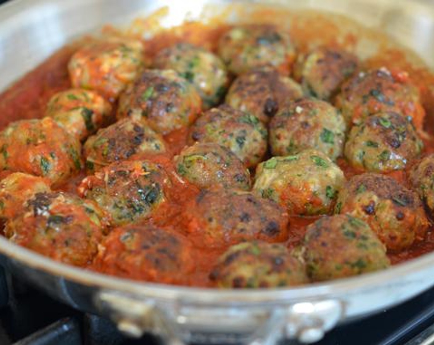 step 5 Meanwhile, heat the tomato Marinara Sauce (1.5 lb) in a large pan on the stovetop. Add the broiled meatballs and simmer over low heat for 5 to 10 minutes, or until the meatballs are fully cooked.