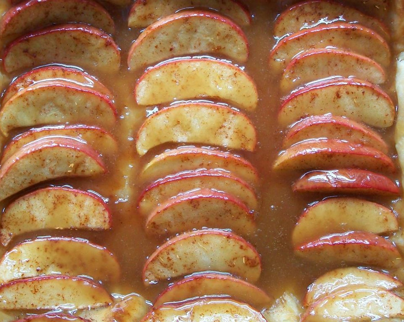 step 5 When the tart is brown and bubbly, remove from the oven and place on a wire rack. Drizzle with the caramel sauce and serve immediately.