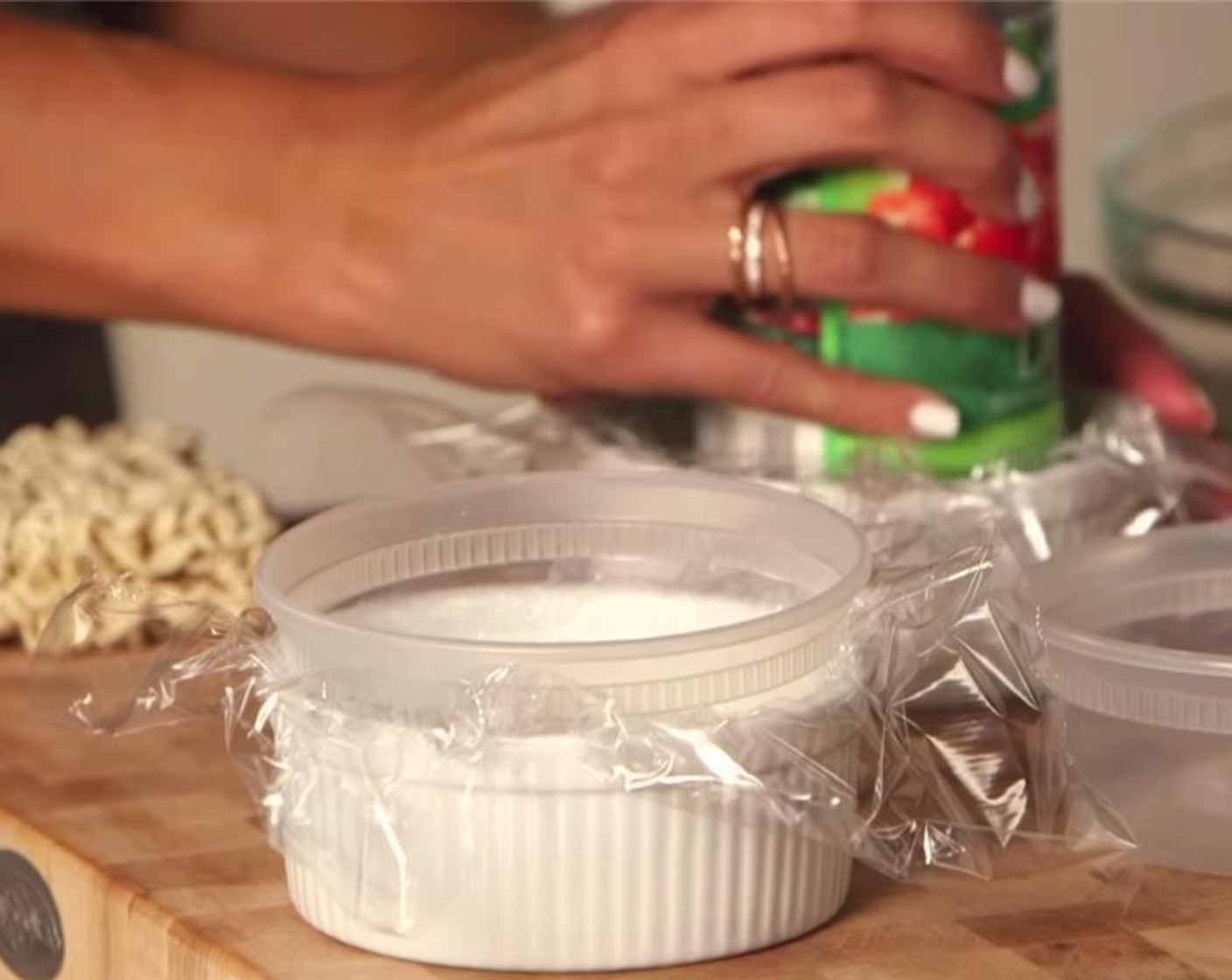 step 3 Cover the ramen with plastic wrap, and weigh it down with a can of soup to compress it into a bun shape. Refrigerate for at least 15 minutes.