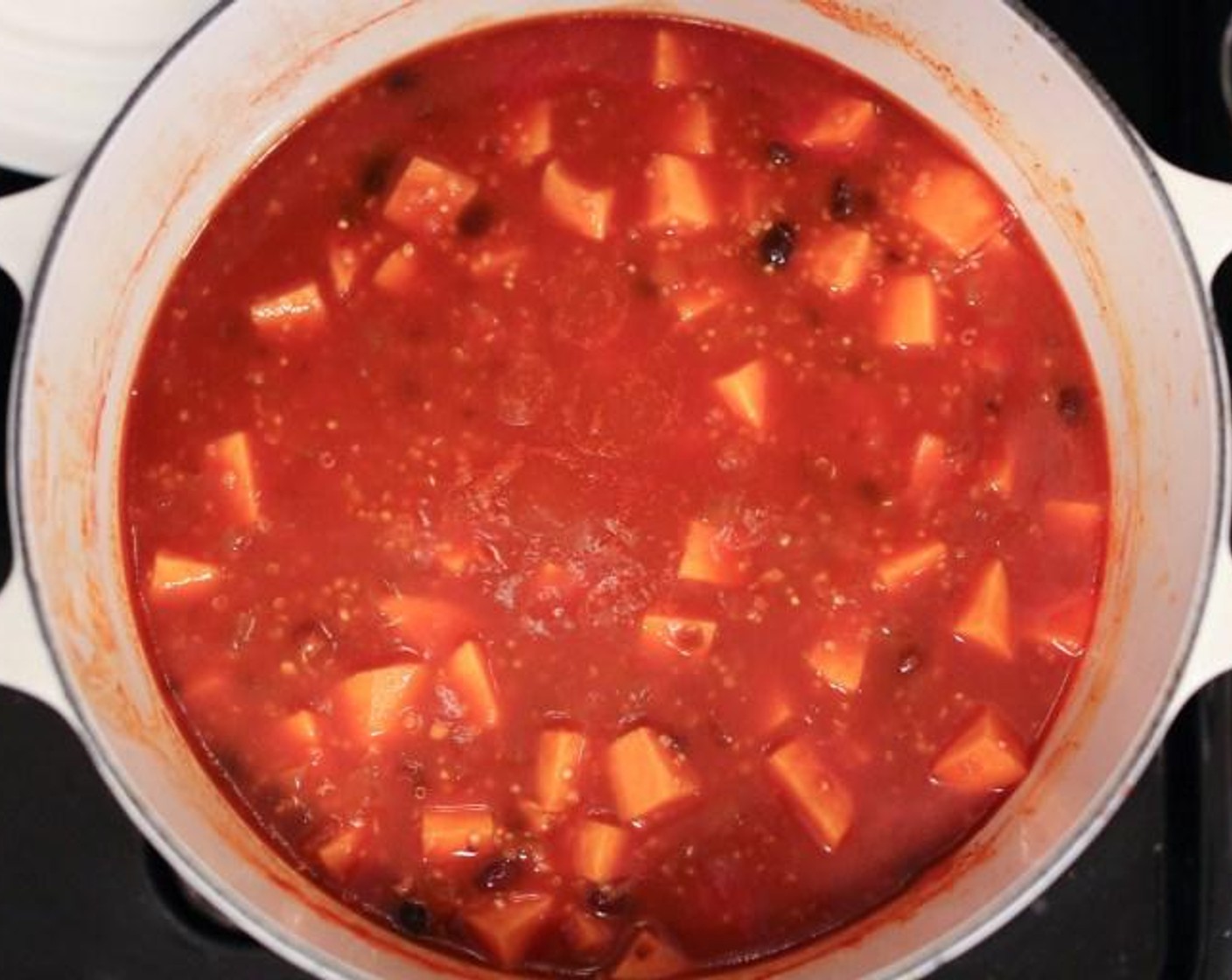 step 4 Stir in the Quinoa (1/3 cup) and simmer for 15 minutes more until the grains and sweet potatoes are tender.